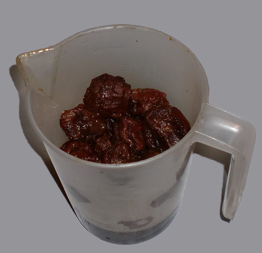 A glass of mocochinchi, the dehydrated peach drink of Bolivia