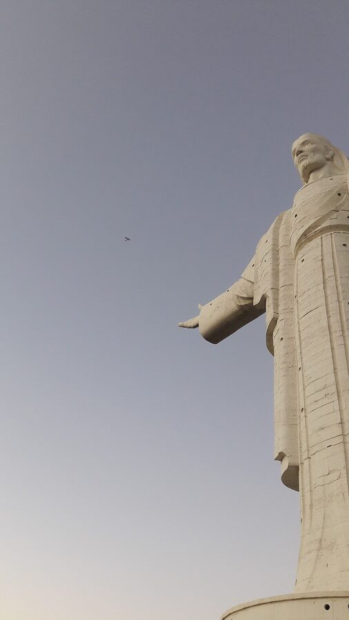 A side view of the Cristo de la Concordia statue