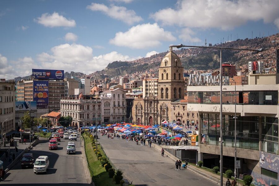 Vendor stalls and shoppers at a market in La Paz, Bolivia