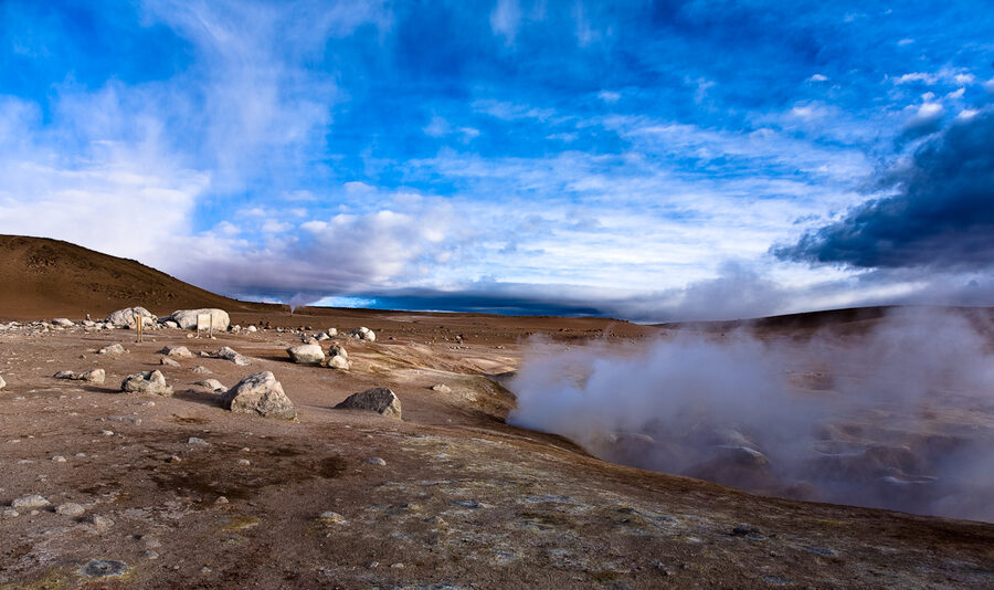 Steam venting from the Sol de Mañana geyser field at sunrise