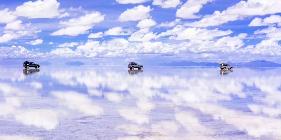 From La Paz: Trip to Uyuni Salt Flats with Wine at Sunset - Crossing the Salar de Uyuni and its salt-water eyes